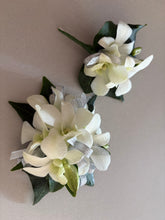 Load image into Gallery viewer, white floral corsage and buttonhole with green leaves on a light gray background