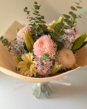 Load image into Gallery viewer, Bouquet of flowers with pink, pastel yellow, and green colors on a light background