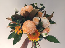 Load image into Gallery viewer, Bright bouquet with disbuds,roses in the medium size,gerberas,filler flowers and foliages of in season ingredients,gift wrapped and delivered with a water bag for freshness.