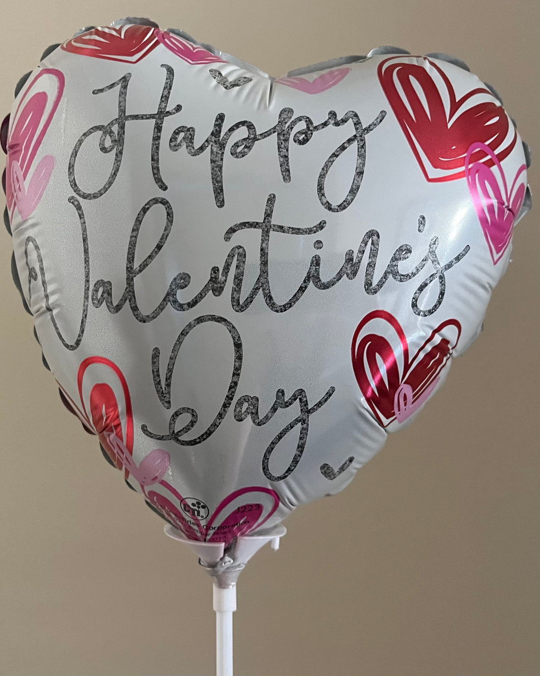 Air filled Valentines balloon on a stick