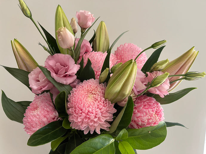 Bella-pretty bouquet .Fresh focal blooms in pinks or your choice 