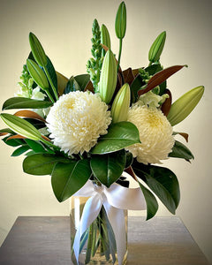 White flowers and foliage in a vase