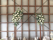 Load image into Gallery viewer, beautiful fresh flowers for Wedding arbour of your choice,we can create a 2 sided design with in season blooms and foliages like roses ,disbuds,orchids,lisianthus,natives .this is to frame the happy couple whilst saying their I do&#39;s.

