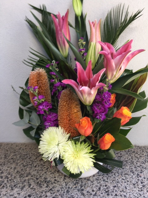 Colourful artistic flower Arrangement ,tall, front facing flower arrangement 