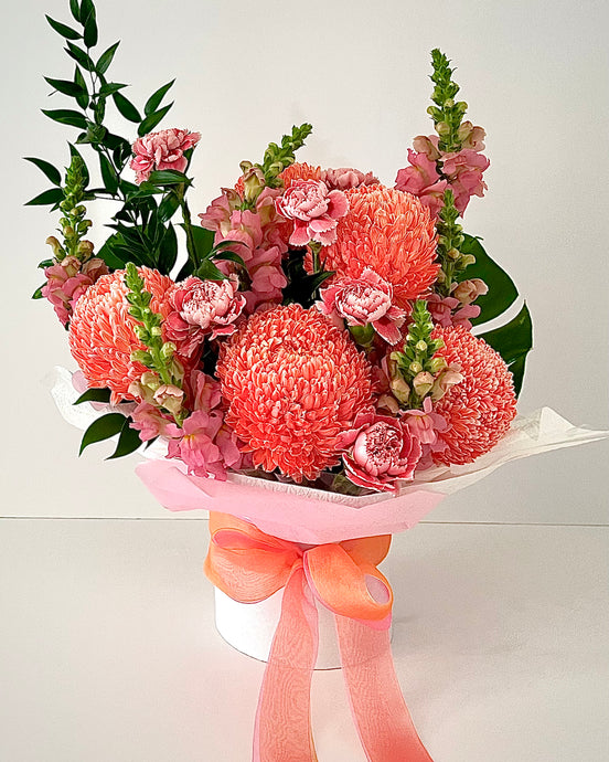 bright flower arrangement .long lasting in a box arrangement , matching ribbon to compliment Flowers 